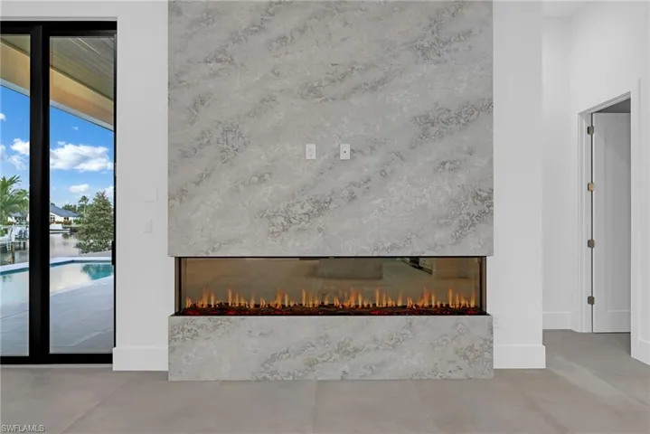 Detailed view of a fireplace and concrete flooring