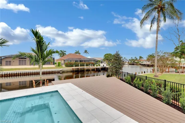 View of pool featuring a water view and a residential view