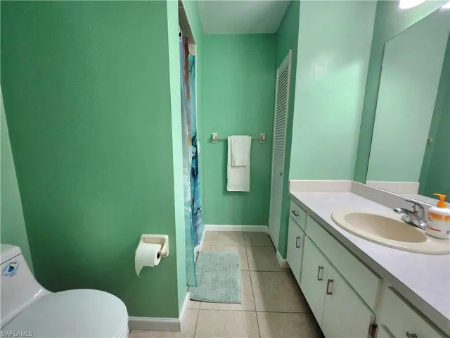 Main bathroom has a shower. Linen closet is across from the shower.