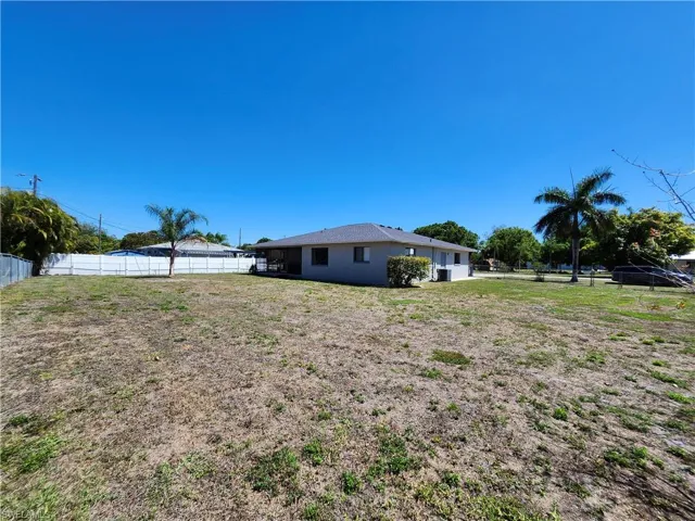 Large fenced in corner 3 lot site.