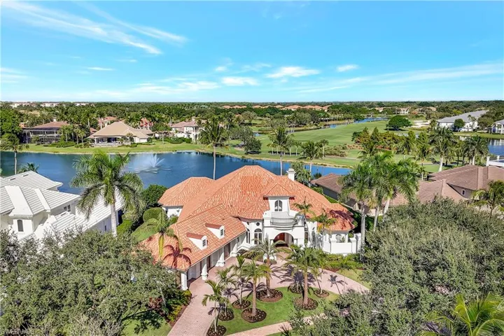 Aerial perspective of suburban area with a large body of water