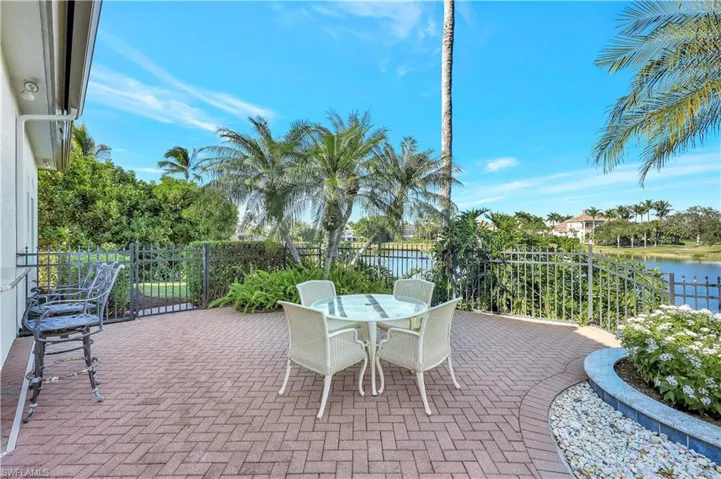 View of patio featuring outdoor dining area and a water view