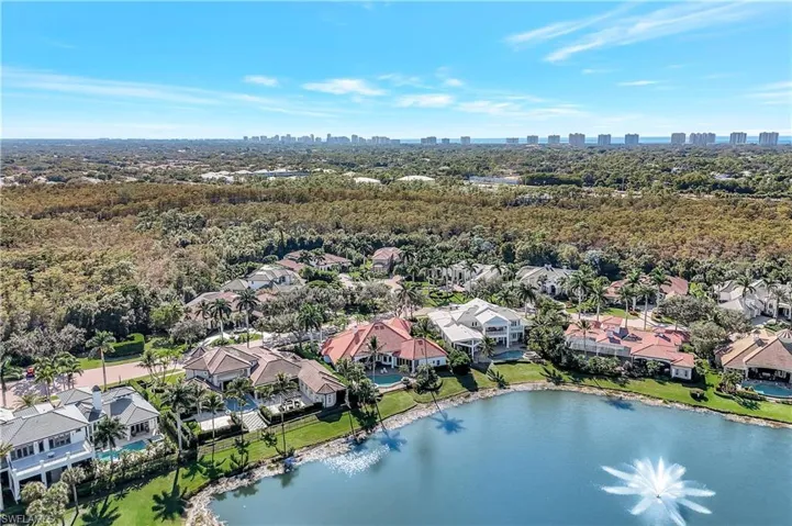 Aerial perspective of suburban area, lake, water feature and city skyline view
