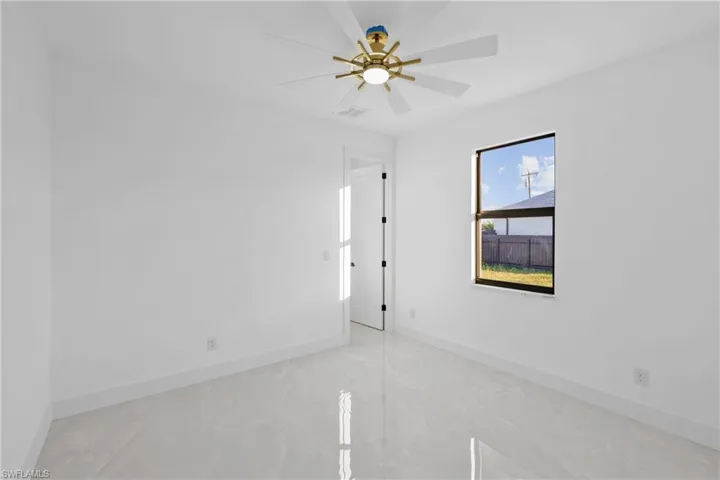 Spare room featuring ceiling fan