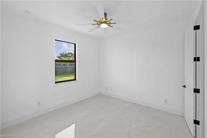 Spare room with ceiling fan