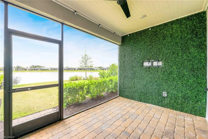 Unfurnished sunroom with a water view
