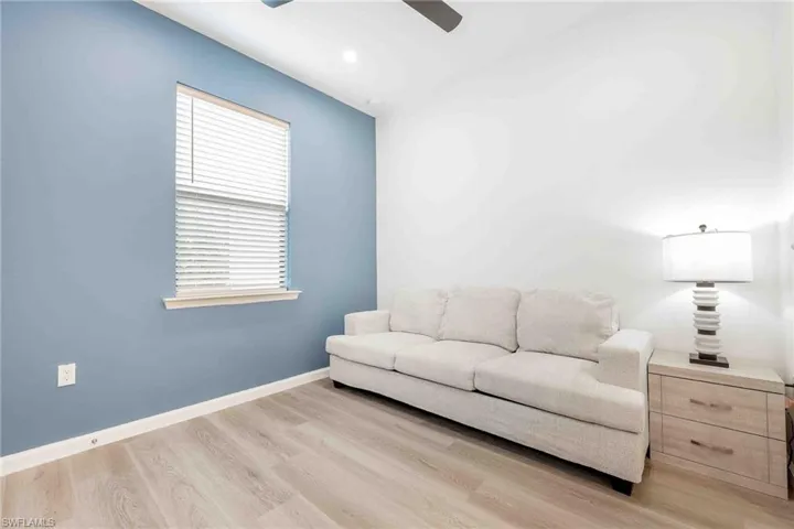 Bedroom featuring baseboards, recessed lighting, ceiling fan, and wood finished floors