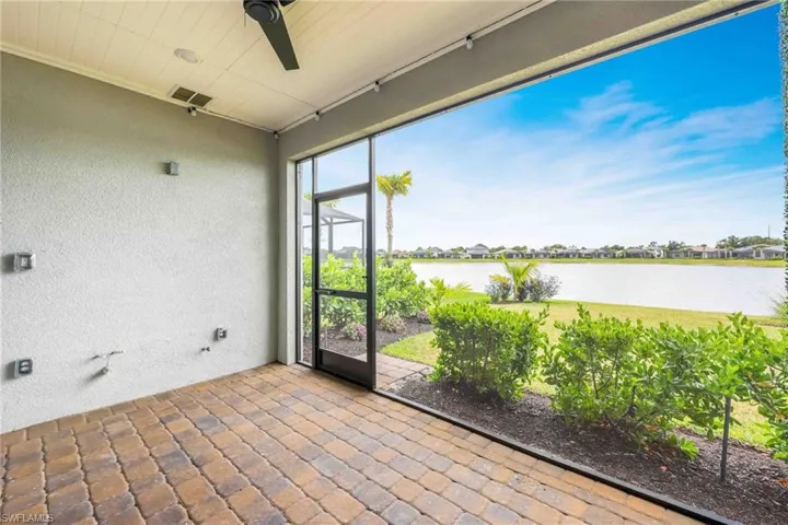Unfurnished sunroom with a water view