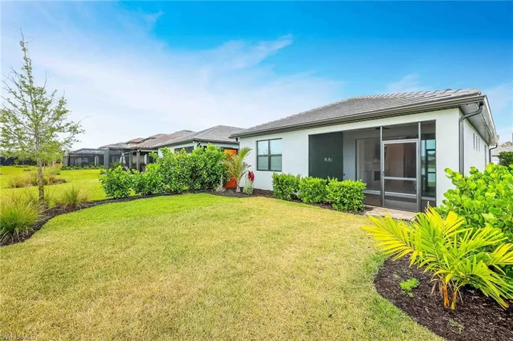 View of yard featuring a sunroom