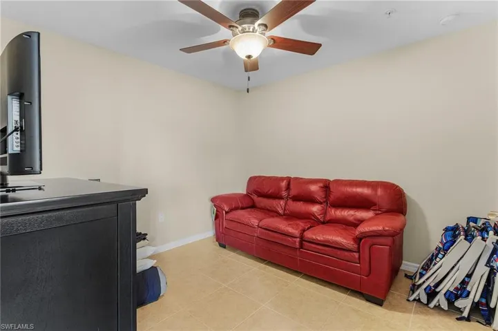 Tiled living room with ceiling fan
