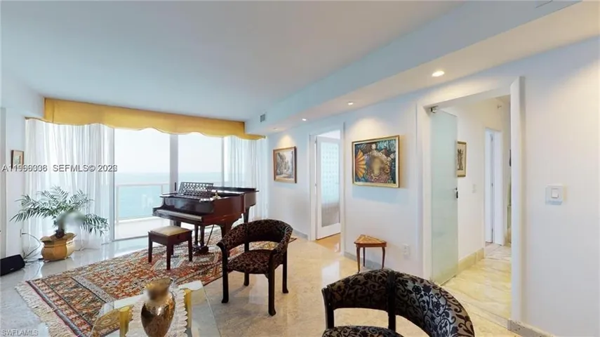 Living area featuring recessed lighting and baseboards
