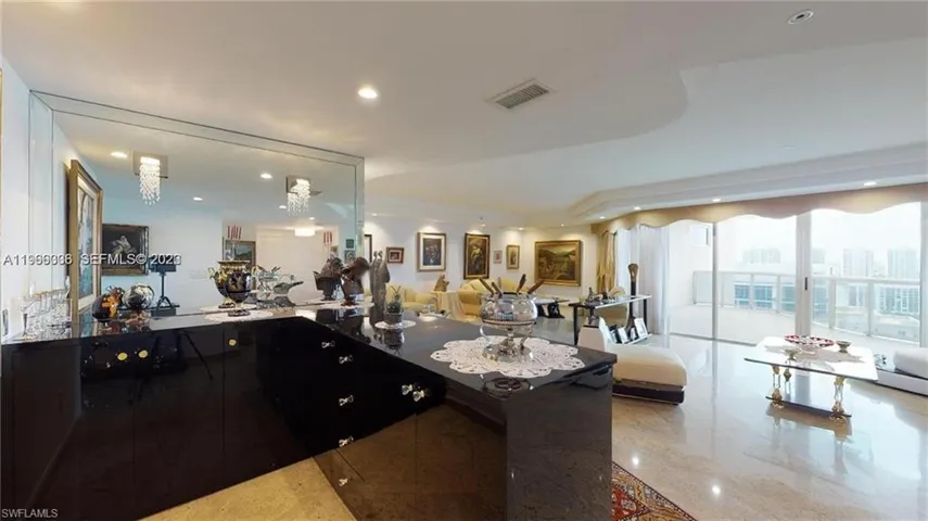 Kitchen with open floor plan and recessed lighting