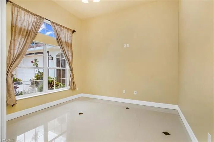 Unfurnished room featuring tile patterned flooring