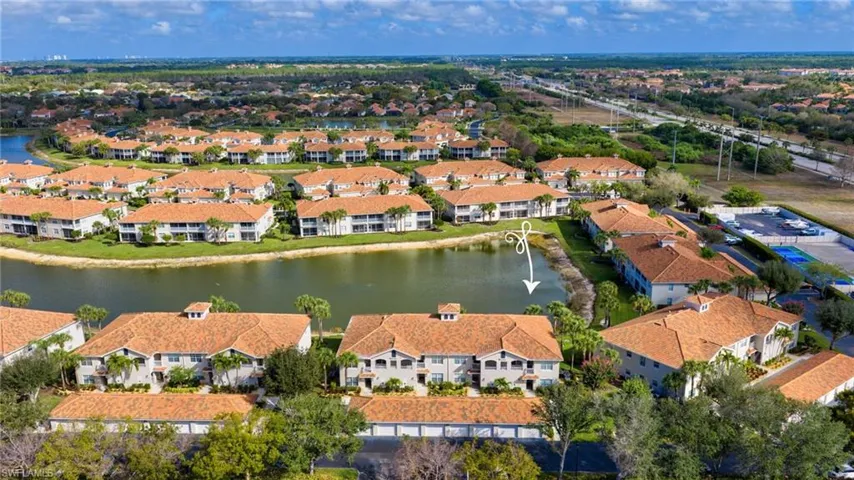 Aerial view of residential area with a large body of water