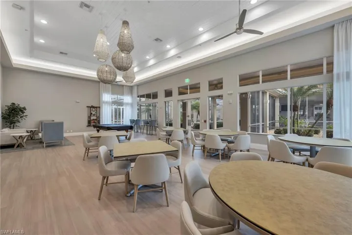 Community lobby with a high tray ceiling and recessed lighting