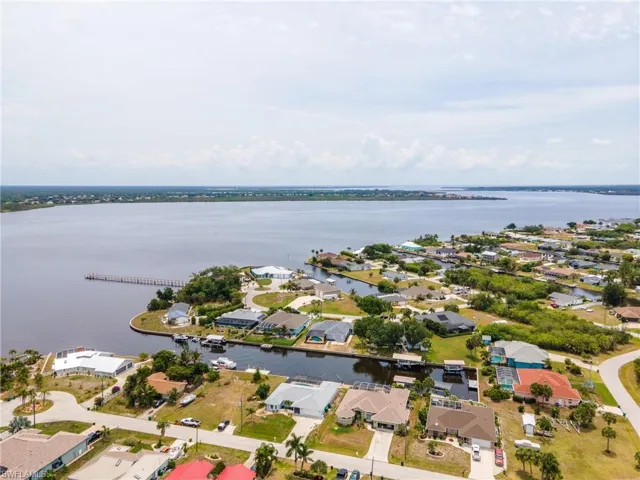 Aerial perspective showcasing waterfront properties with private boat docks