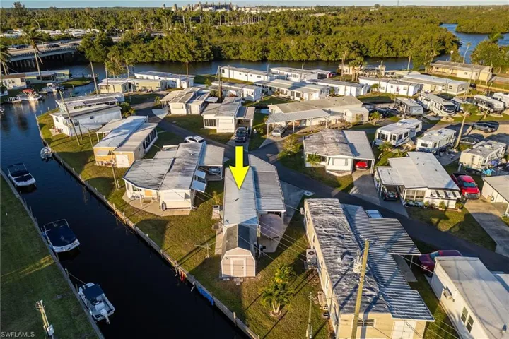 Birds eye view of property featuring a residential view and a water view