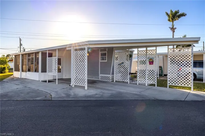 View of front facade with a sunroom