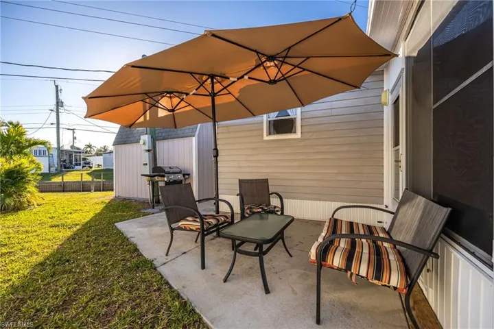 View of patio / terrace with grilling area and fence