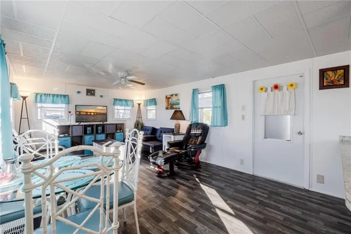 Dining room with ceiling fan and wood finished floors