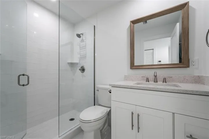 Bath with walkin shower.