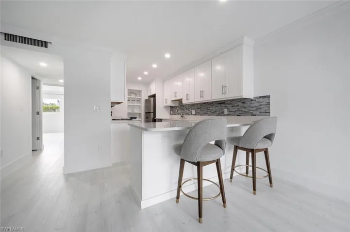 Kitchen on right.  Hall to bed/bath on left.