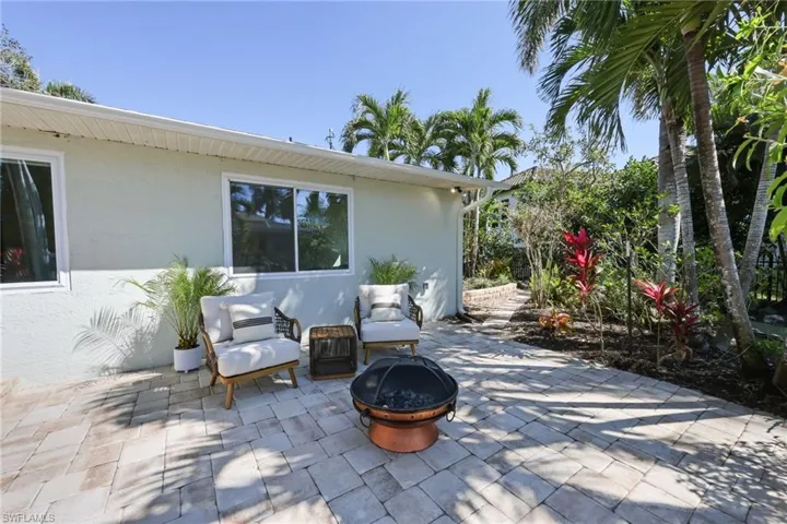 View of patio featuring an outdoor fire pit