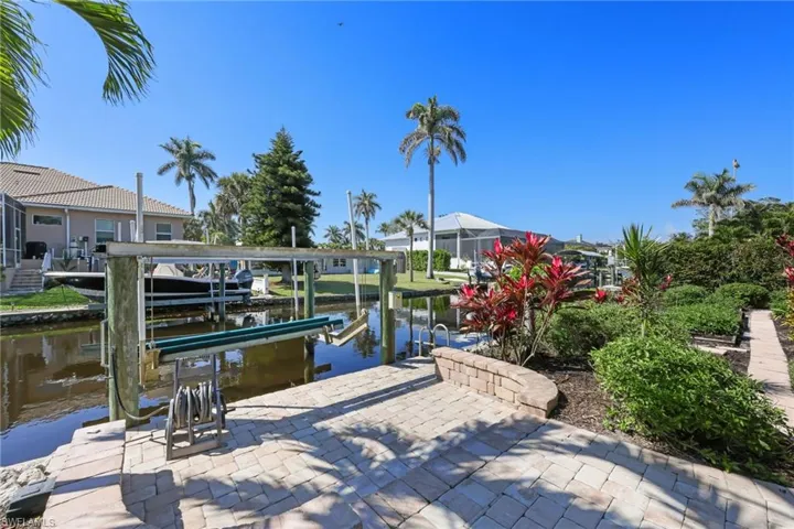 View of dock with a water view and boat lift
