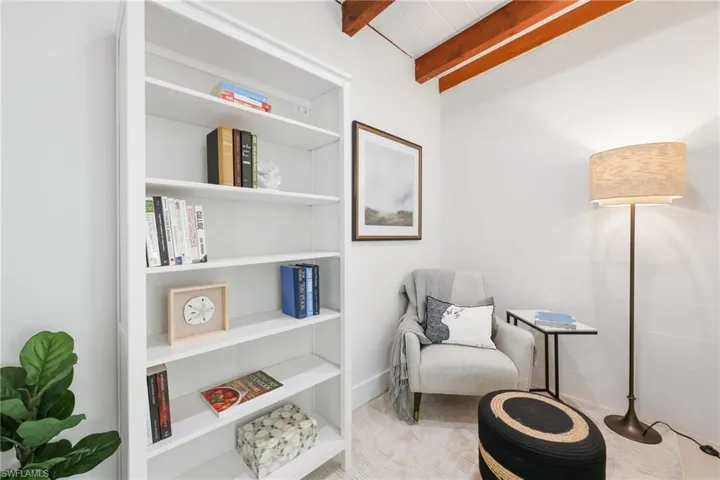 Living area with beamed ceiling