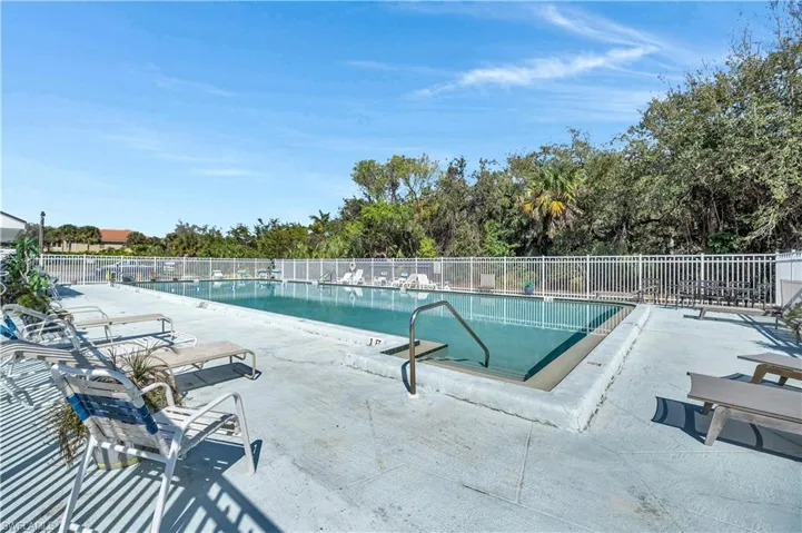 Community pool featuring a patio