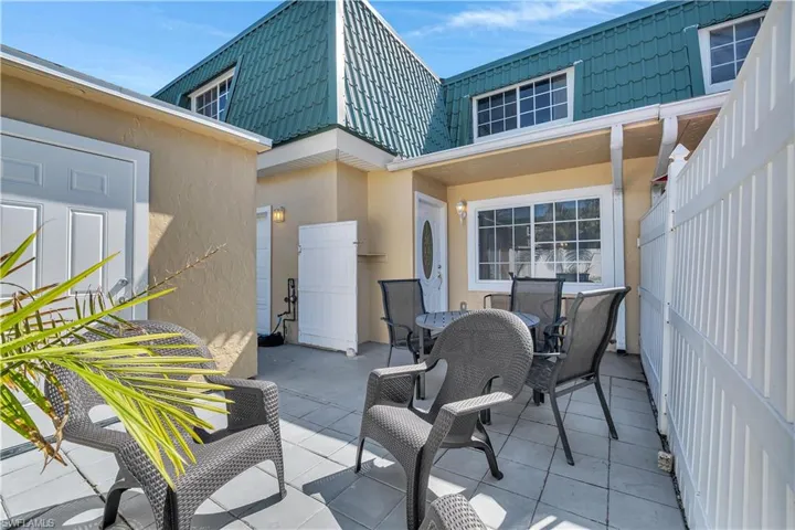 View of courtyard featuring outdoor dining area