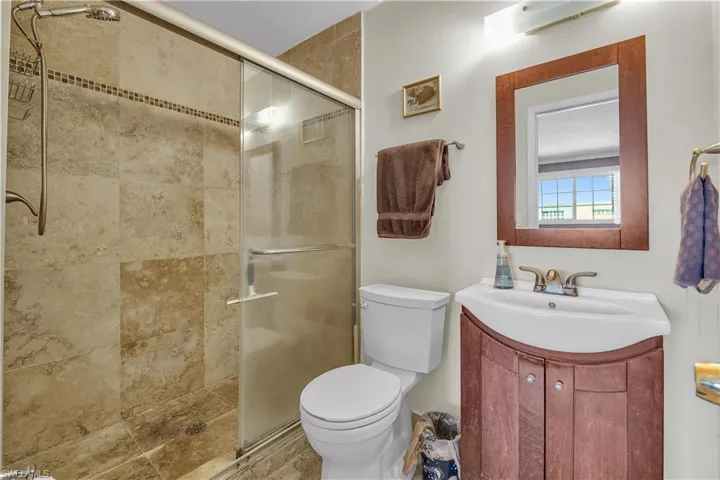 Full bath with vanity and a stall shower