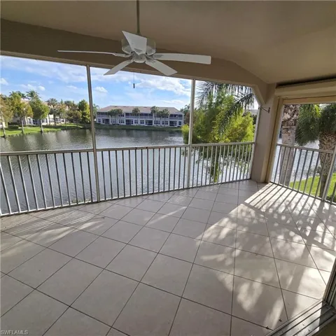 Unfurnished sunroom with a water view and healthy amount of natural light