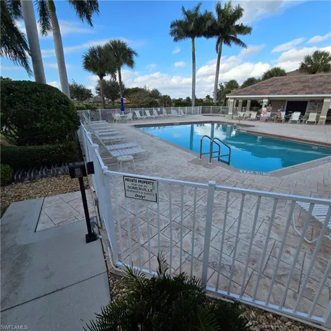 Community pool featuring a patio
