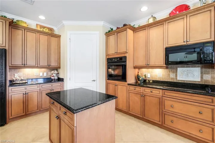 Spacious kitchen with ample storage and counter space.