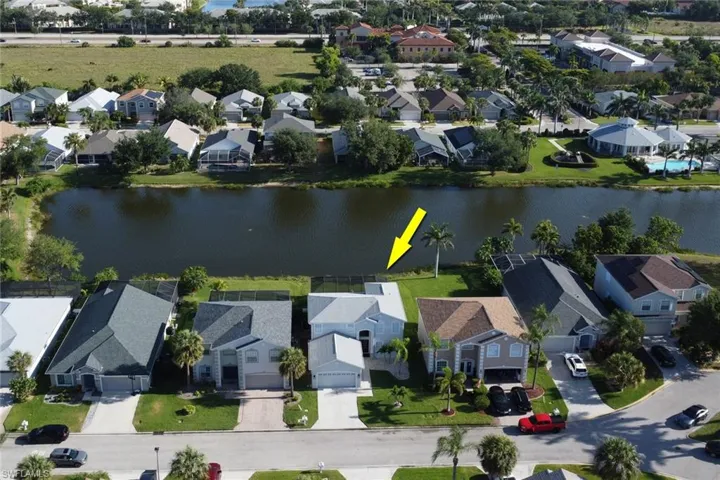 Drone / aerial view featuring a water view and a residential view