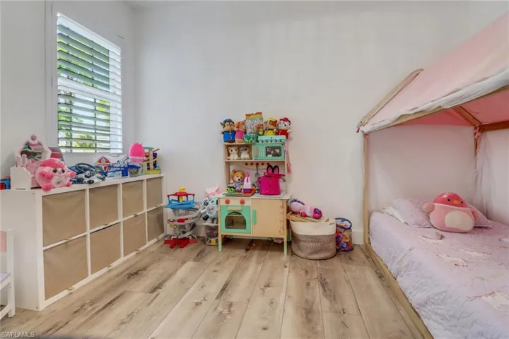 Bedroom with wood finished floors
