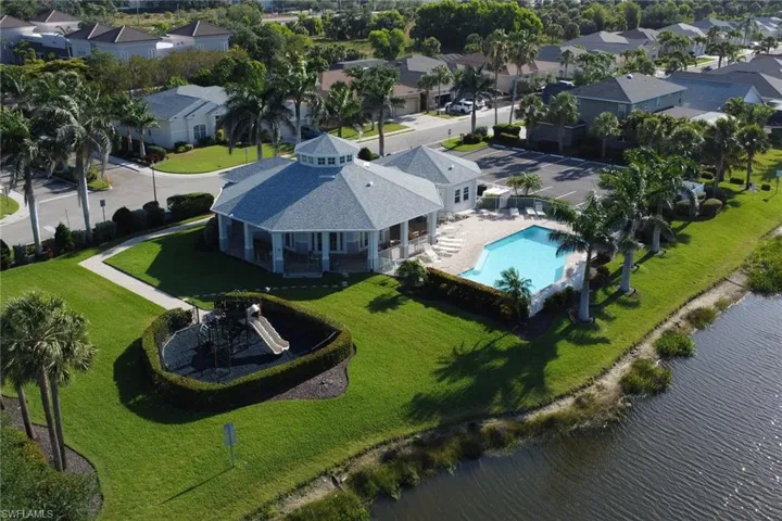 Bird's eye view with a water view and a residential view