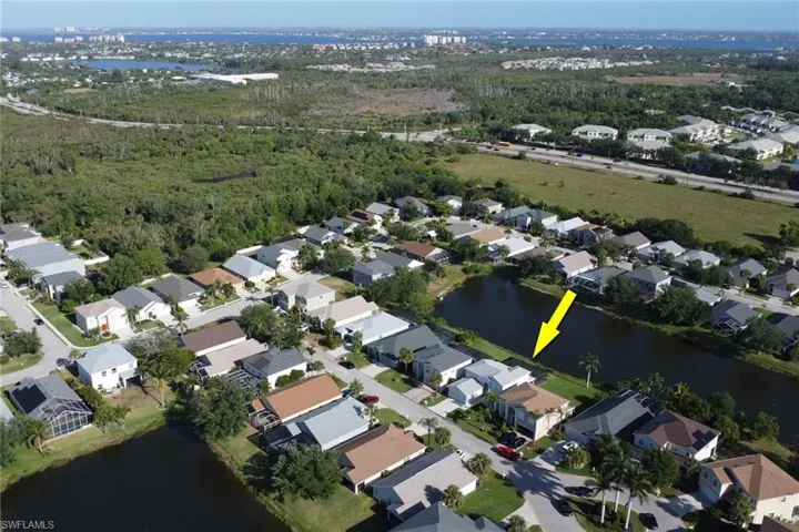 Aerial view with a residential view and a water view