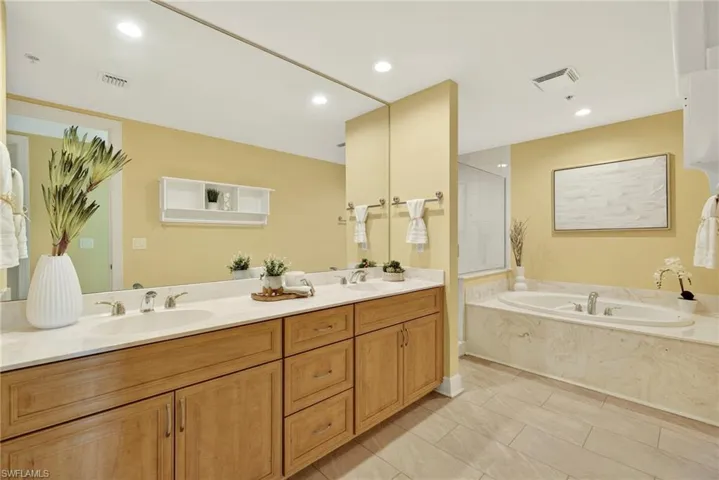 Guest Bathroom with Double Vanity and Soaking Tub & Shower