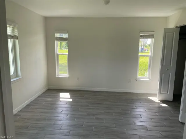 Primary bedroom featuring a wealth of natural light