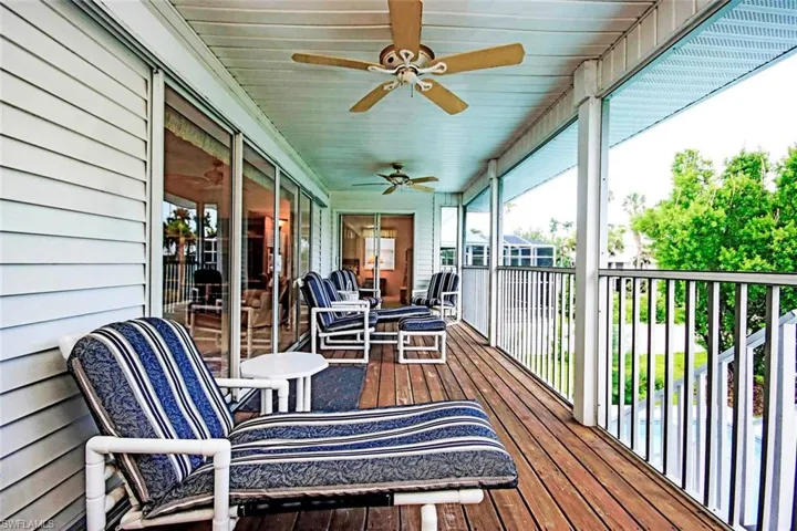Sunroom with a ceiling fan