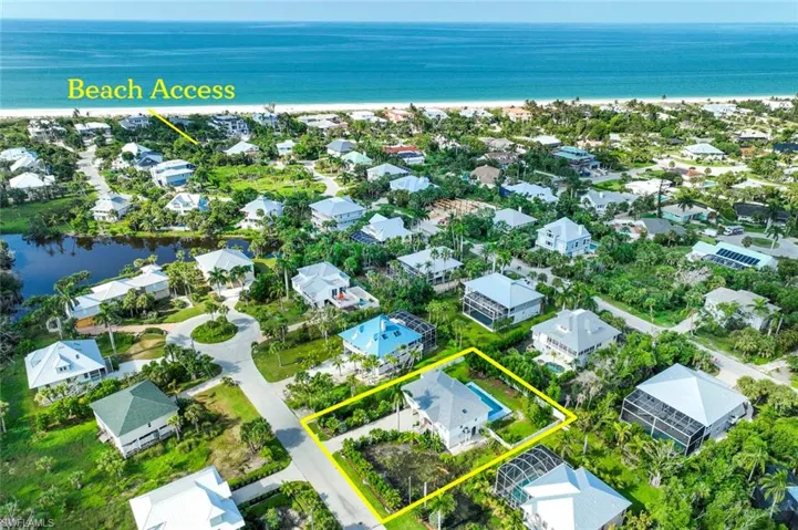 Aerial view featuring a water view and a residential view