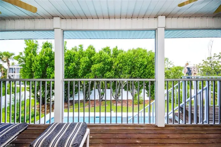 Wooden deck featuring a ceiling fan
