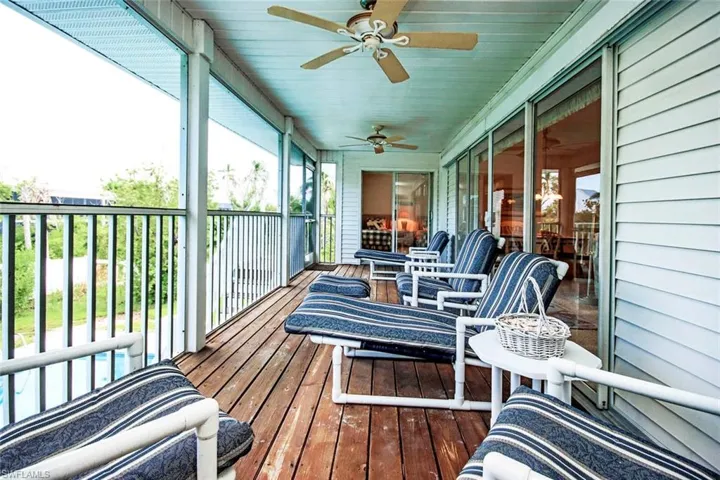 Sunroom featuring ceiling fan