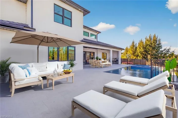 Relaxing pool / spa featuring outdoor lounge area and a patio area