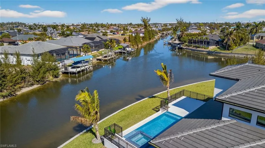 Aerial perspective of suburban area with a large body of water