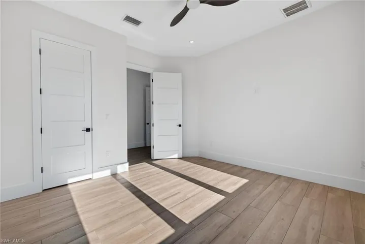 Unfurnished bedroom with light wood-style flooring and ceiling fan