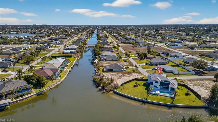 Aerial overview of property's location with nearby suburban area