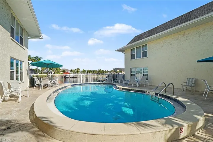 Community pool with a patio area